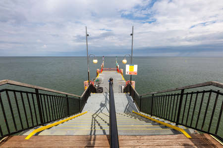 Miedzyzdroje, Zachodniopomorskie / Poland - August, 28, 2020: Pier in a holiday resort on the Baltic Sea. A place of rest and relaxation in Central Europe. Summer season.のeditorial素材