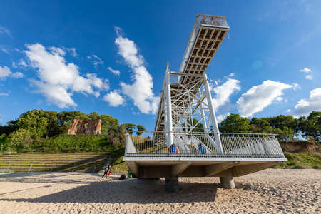 Trzesacz, Zachodniopomorskie / Poland - August, 29, 2020: Metal deck to view church ruins. Metal structure on the Baltic beach. Summer season.のeditorial素材