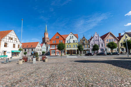 Trzebiatow, Zachodniopomorskie / Poland - August, 30, 2020: A market square with old tenement houses in a small town. City center in Central Europe. Summer season.のeditorial素材