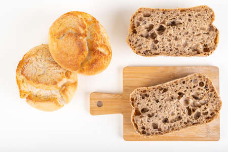 Tasty fresh bun and canned meat. A modest food ration for the prisoner. Light background.の写真素材