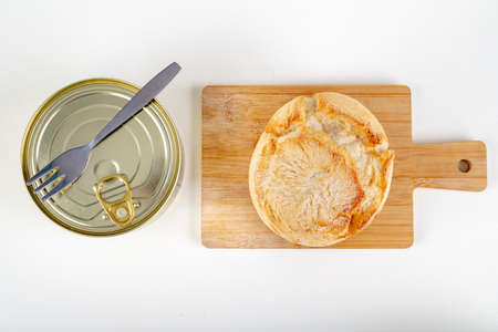 Tasty fresh bun and canned meat. A modest food ration for the prisoner. Light background.の写真素材