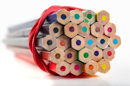 Colored pencils for drawing in a bunch. Accessories and drawing tools for graphic designers. Light background.の写真素材