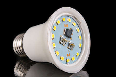 The interior of the led bulb. Chips and leds in a modern led fluorescent lamp. Black background.の写真素材