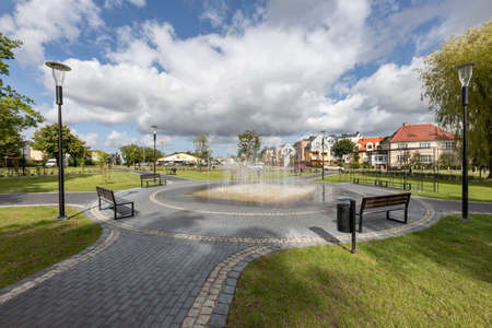 Slawno, Zachodniopomorskie / Poland - September, 10, 2020: A fountain, benches and alleys in a small town. A place to rest for residents. Autumn season.のeditorial素材