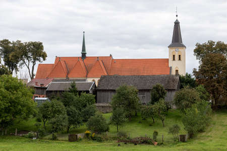 Sliwice, kujawsko pomorskie / Poland - September, 11, 2020: Catholic Church in the center of a small town in Pomerania. Brick Christian temple. Autumn season.のeditorial素材