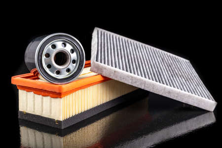Oil and air filter for passenger car. Consumables for internal combustion engines. Dark background.の写真素材