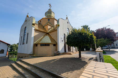 Koszalin, West Pomeranian Voivodeship / Poland - September, 16, 2020: Temple with a roof covered with gold. The Christian Church in Modern Architecture. Autumn season.のeditorial素材