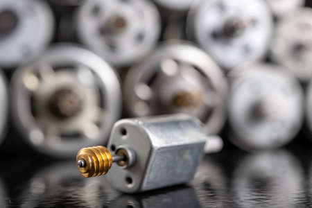 Small electric motor with worm gear. Electric accessories for repairing power tools. Dark background.の写真素材