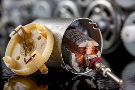 Rotor of a small electric motor. Electric accessories for repairing power tools. Dark background.の写真素材