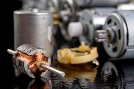 Rotor of a small electric motor. Electric accessories for repairing power tools. Dark background.の写真素材