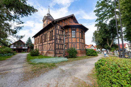 Marzecin, Pomorskie / Poland - September, 22, 2020: Catholic Church in the center of a small town in Pomerania. Brick Christian temple. Autumn season.のeditorial素材