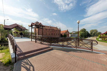 Nowy Dwor Gdanski, Pomorskie / Poland - September, 22, 2020: A small bridge across a river in a small town. Paddle for pedestrians over the river channel. Autumn season.のeditorial素材