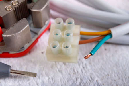Electric cord and tools for installation. Electrical accessories for the production worker. Light...