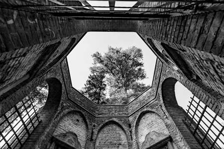 Prabuty, pomorskie / Poland - September, 25, 2020: Old brick building in an old cemetery. Temple ruins in Europe. Autumn season.のeditorial素材