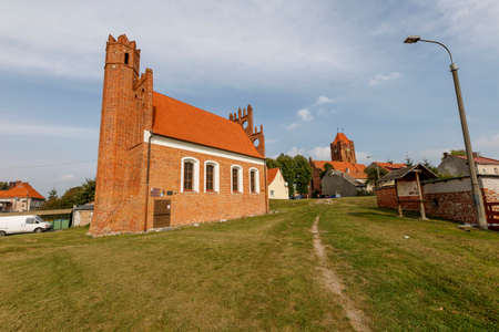 Prabuty, Pomorskie / Poland - September, 25, 2020: The Polish Church in the center of a small town in Pomerania. Brick Christian temple. Autumn season.のeditorial素材