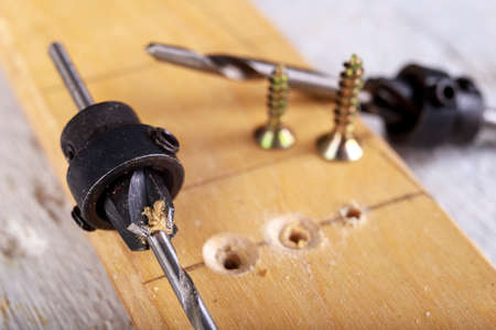 Wood drill bit with adjustable countersink. Carpentry accessories in the workshop. Minor work in the carpentry shop.の写真素材
