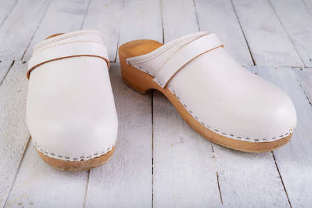 White clogs on a white table. Footwear intended for medical personnel. Light background.の写真素材