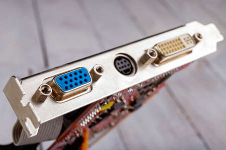 Graphics card connectors. The place to connect the signal cable transmitting the image to the monitor. Light background.の写真素材