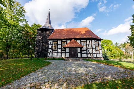 Cieszyno, Zachodniopomorskie / Poland - October, 08, 2020: Old Catholic Church in the center of a small town. Brick Christian temple. Autumn season.のeditorial素材