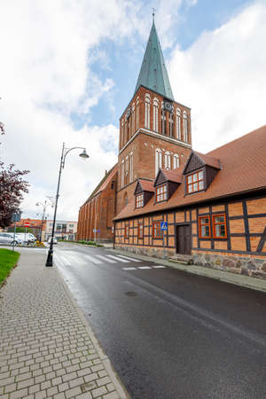 Drawsko, Zachodniopomorskie / Poland - October, 09, 2020: Old Catholic Church in the center of a small town. Brick Christian temple. Autumn season.のeditorial素材