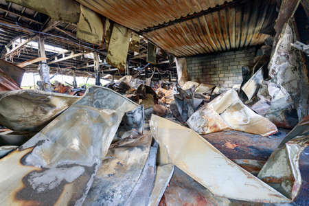 Zlocieniec, Zachodniopomorskie / Poland - October, 09, 2020: Burned down production hall. Destroyed factory in Central Europe. Autumn season.のeditorial素材