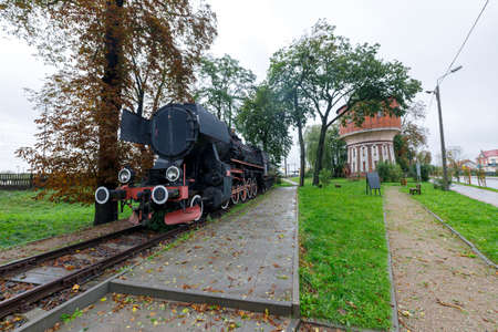 Jablonowo Pomorskie, kujawskopomorskie / Poland - October, 14, 2020: Historic steam locomotive set up as a monument. Railway station identification symbol. Autumn season.のeditorial素材