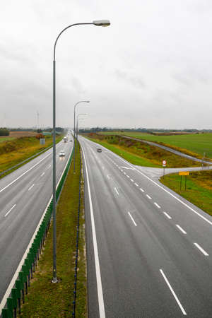 Dzialowo, kujawskopomorskie / Poland - October, 14, 2020: View of the highway in the rain from a road bridge. Two lanes on a national road in Central Europe. Autumn season.のeditorial素材