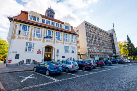 Nowogard, Zachodniopomorskie / Poland - October, 22, 2020: The seat of the city authorities. Old brick building intended for administration offices. Autumn season.のeditorial素材