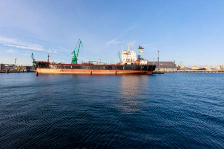 Gdynia, Pomorskie / Poland - October, 25, 2020: Old harbor wharf in Central Europe. Ships and port facilities. Autumn season.のeditorial素材