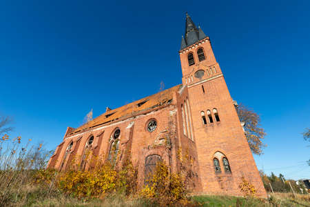 Pogodki, pomorskie / Poland - November, 4, 2020: Old dilapidated evangelical church. A large brick building in Central Europe. Autumn season.のeditorial素材