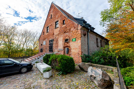Skarszewy, Pomorskie / Poland - November, 4, 2020: A small castle of the Knights Hospitaller in Poland. A small brick historic building in Central Europe. Autumn season.のeditorial素材