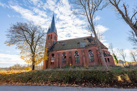 Pogodki, pomorskie / Poland - November, 4, 2020: Old dilapidated evangelical church. A large brick building in Central Europe. Autumn season.のeditorial素材