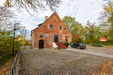 Skarszewy, Pomorskie / Poland - November, 4, 2020: A small castle of the Knights Hospitaller in Poland. A small brick historic building in Central Europe. Autumn season.のeditorial素材