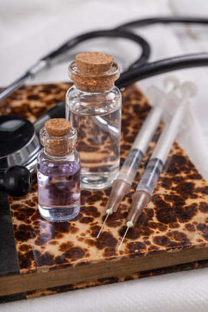 Basic medical kit prepared for vaccinations. Protective clothing and medical accessories. Light background.の写真素材