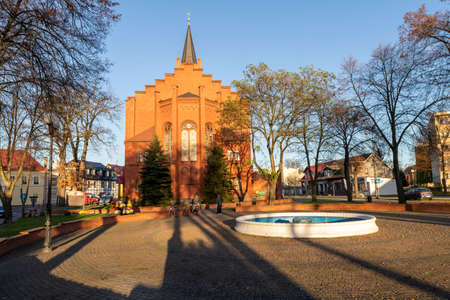 Jastrowie, wielkopolskie / Poland - November, 20, 2020: Old Catholic Church in the center of a small town. Brick Christian temple. Autumn season.のeditorial素材