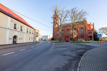 Jastrowie, wielkopolskie / Poland - November, 20, 2020: Old Catholic Church in the center of a small town. Brick Christian temple. Autumn season.のeditorial素材