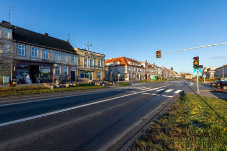 Jastrowie, wielkopolskie / Poland - November, 20, 2020: Main intersection in a small town. Old tenement houses on a busy street. Autumn season.のeditorial素材