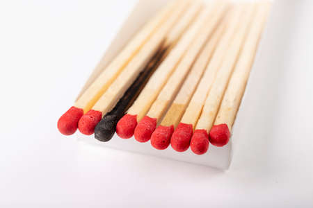 Matches in a white cardboard box. Accessories for starting fire. Light background.の写真素材
