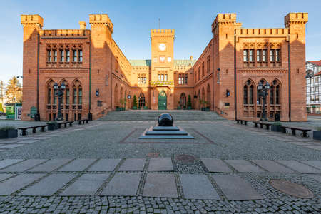 Kolobrzeg, Zachodniopomorskie / Poland - November, 25, 2020: Town Hall in a city in Pomerania. Old tenement houses and streets in the city center. Autumn season.のeditorial素材