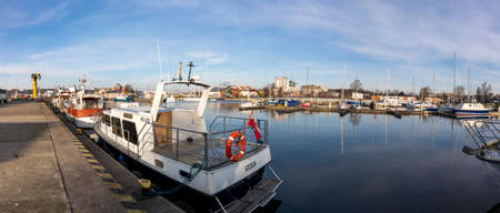 Kolobrzeg, Zachodniopomorskie / Poland - November, 25, 2020: Port in the city located on the Baltic Sea. A marina for mooring vessels. Autumn season.のeditorial素材
