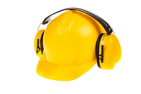 Yellow hard hat for construction workers. Protective clothing and accessories for employees. Light background.の写真素材