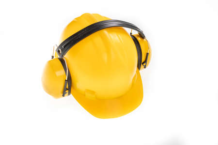 Yellow hard hat for construction workers. Protective clothing and accessories for employees. Light background.の写真素材
