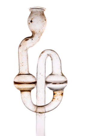 Old dirty fermentation tube. Glass accessories for wine fermentation. Light background.の写真素材
