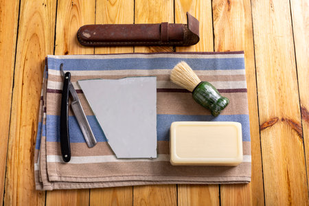 Razor, brush and beard shaving soap. Men's personal hygiene accessories. Dark background.の写真素材