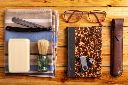 Razor, beard brush and USB flash drive. Personal care accessories for men on the go. Dark background.の写真素材