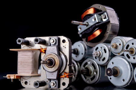 Small electric motors used in household appliances. Devices for driving various small devices. Dark background.の写真素材