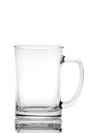 Empty mug for alcoholic drinks. Thick glass container for storing liquid. Light background.の写真素材