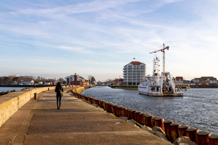 Darlowko, West Pomeranian Voivodeship Poland - December, 17, 2020: Breakwater and entrance to a small fishing port. Port locations in Central Europe. Autumn season.のeditorial素材