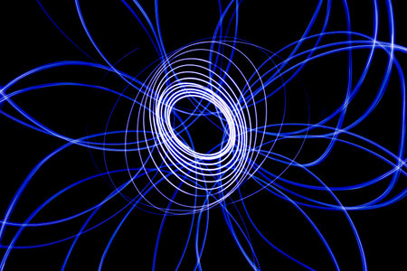 Light streaks in the shape of circles. A trace of a moving light point. Dark background.の写真素材