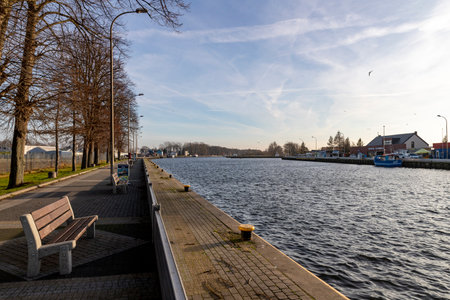 Darlowko, West Pomeranian Voivodeship Poland - December, 17, 2020: Port in a small town on the Baltic Sea. The port channel and buildings in Central Europe. Autumn season.のeditorial素材